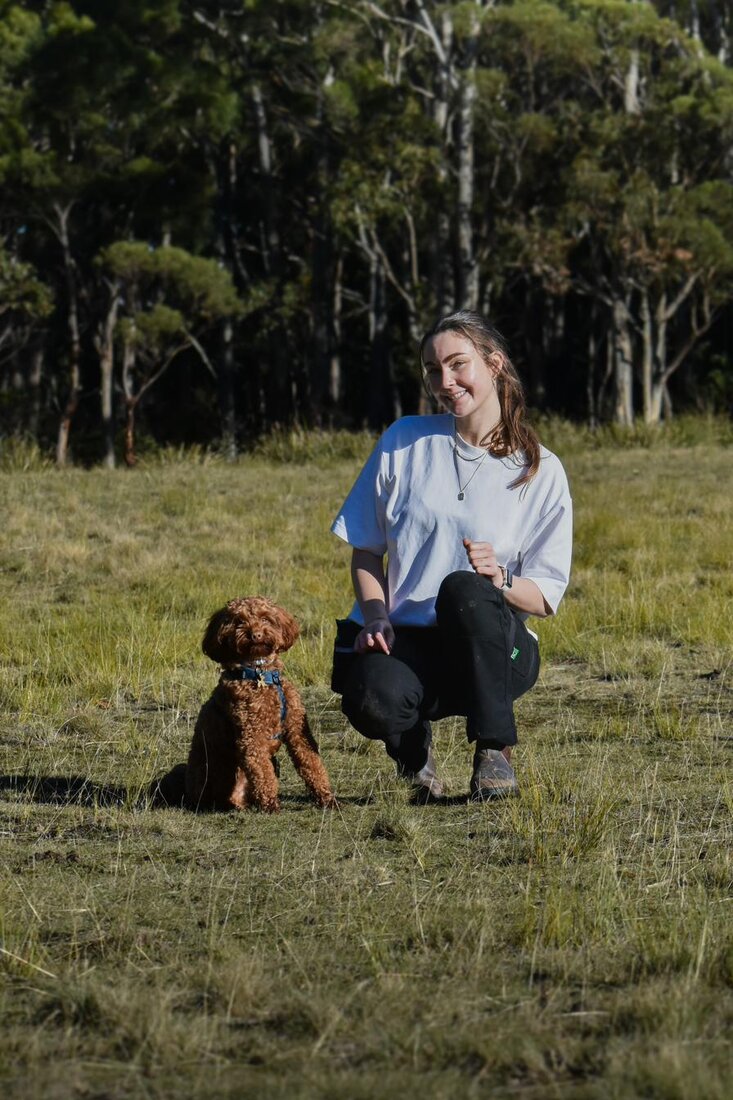 Sophie coaching a dog through an outdoor training session